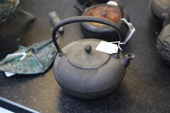 Five Japanese cast iron teapots, two with lacquer covers, 19th century, largest 19cm wide